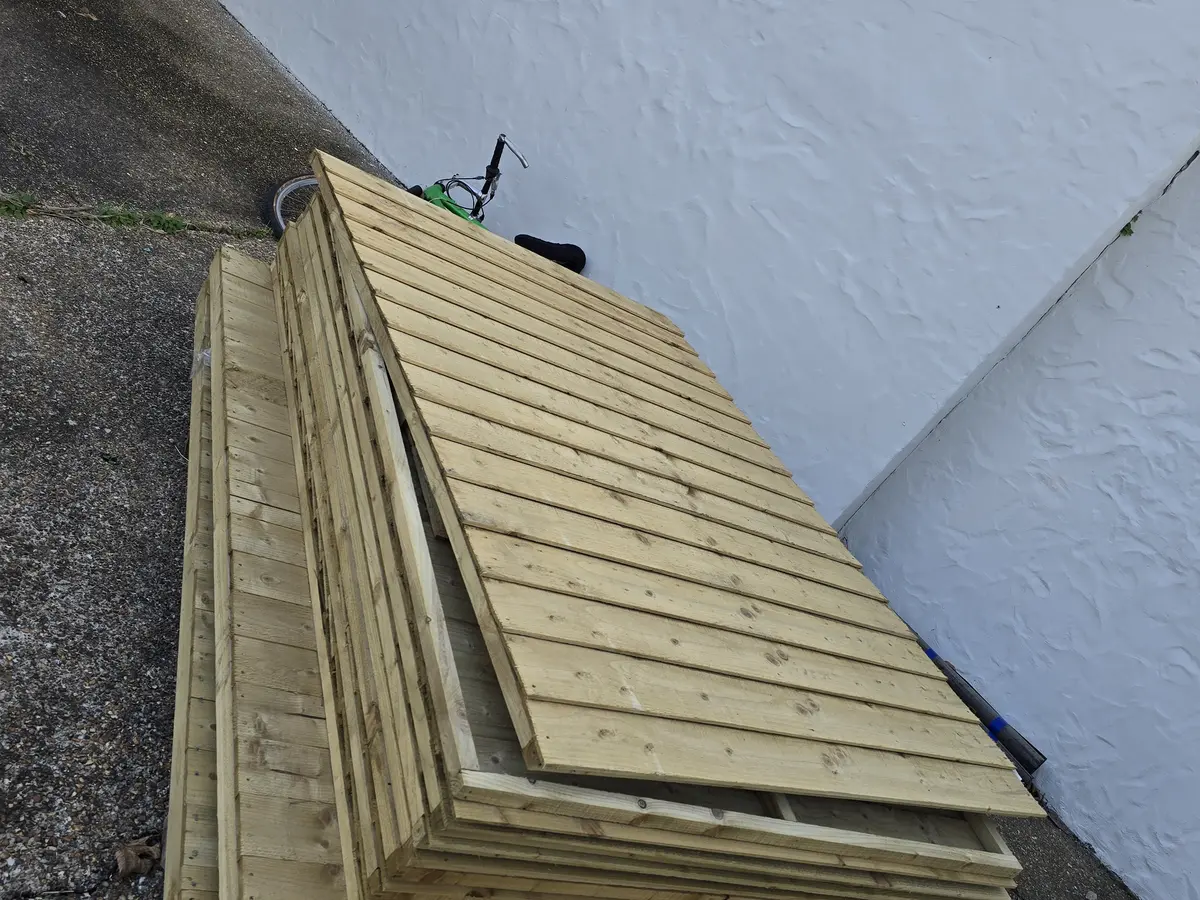 New timber fence panels ready for installation in Guernsey